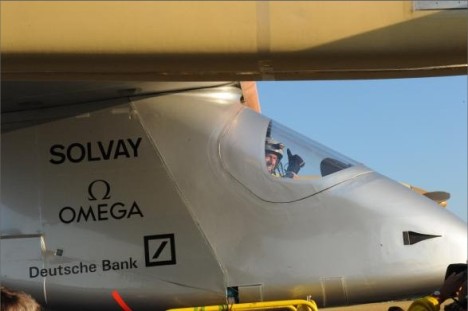close up of the nose of Solar Impulse, with André Borschberg doing a 'thumb-up' before take-off
